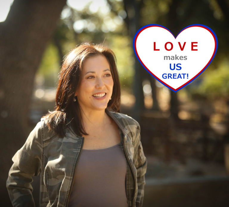 Joyce standing in trees.