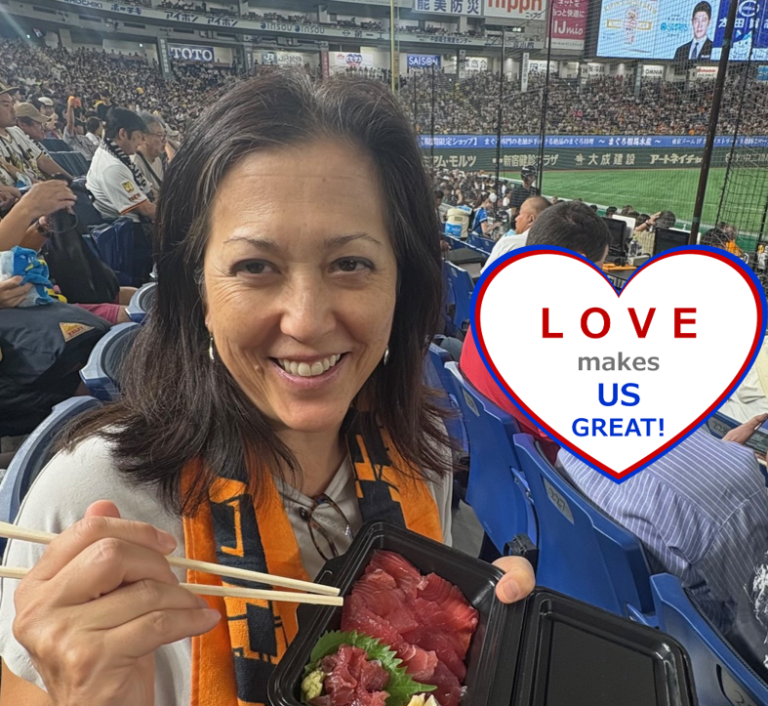 Joyce at Tokyo Giants baseball game with a tray of sashimi