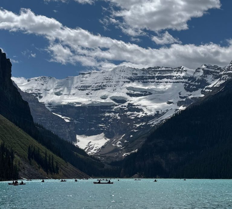 Lake Louise Lake Louise, Alberta, Canada. Green blue sparking water of the lake surrounded by snow covered mountains