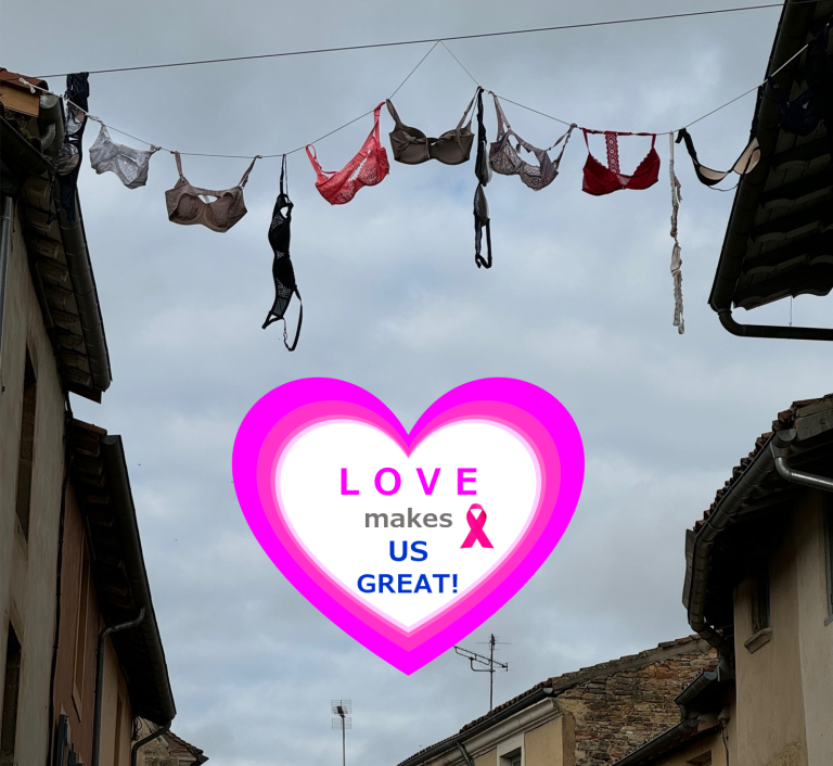 a streamer made of bras hanging between two buildings in France during breast cancer awareness month